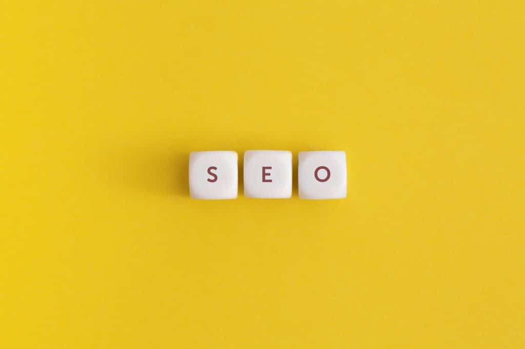 The word seo on yellow background. Top view. Flat lay.