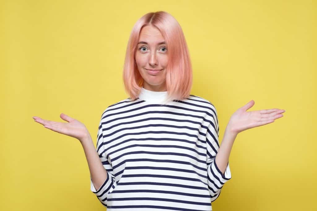 Woman compares two options and is not sure which one to choose
